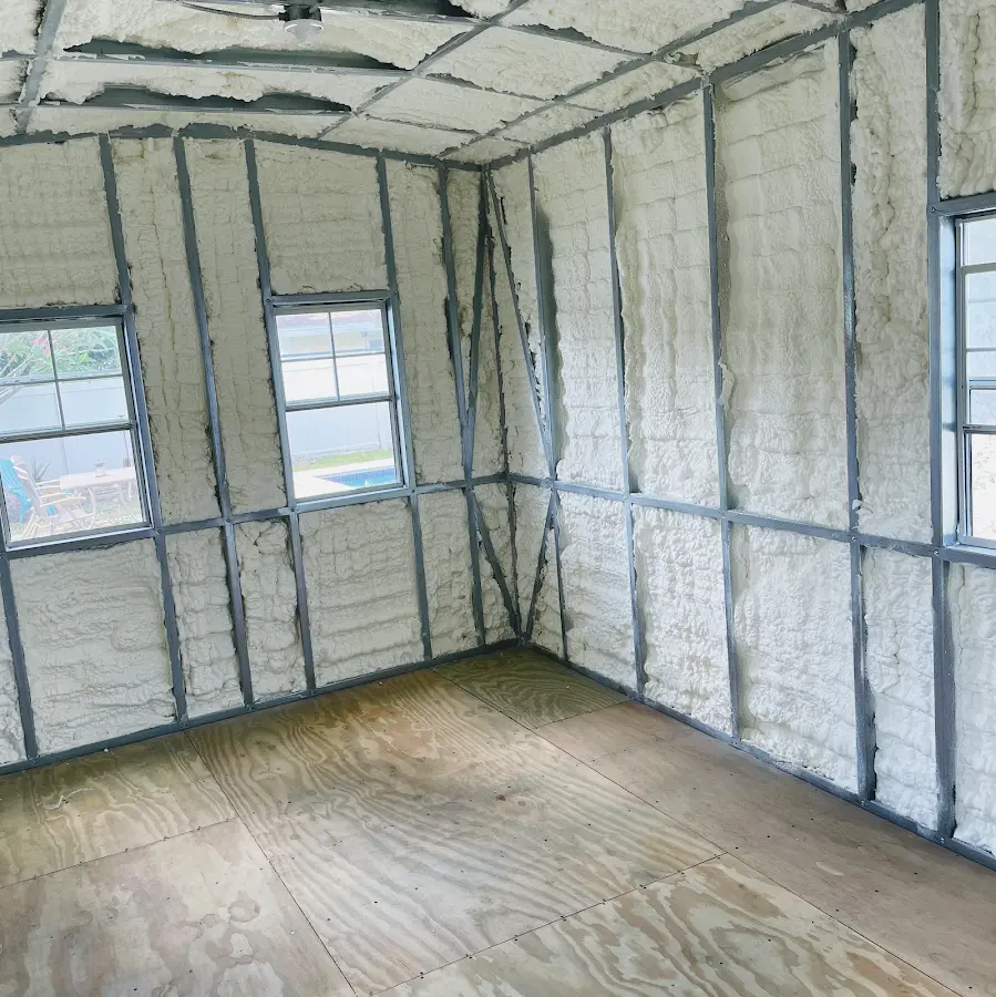Closed-cell spray foam insulation applied to wall cavities in a residential project in Stone Mountain
